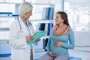 Pregnant patient consulting a doctor